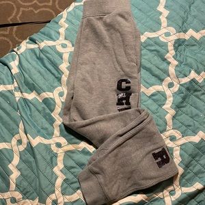 Sweatpants has pockets that says cheerleading